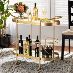 Kamal Glam Brushed Metal And Mirrored Glass 2 Tier Mobile Wine Bar Cart Gold - Baxton Studio -Baxton Studio Store GUEST 034e04a5 db63 474b 9d05 6c159816da1c